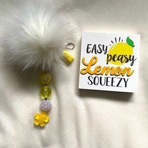 Yellow and white puff bubblegum bead keychain with flower and tassel